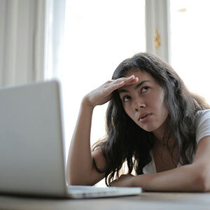 Frustrated woman reading legal document, highlighting misunderstanding in premarital agreement