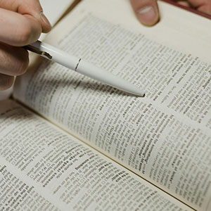 Close-up of hand pointing at legal contract clause potentially violating Texas public policy